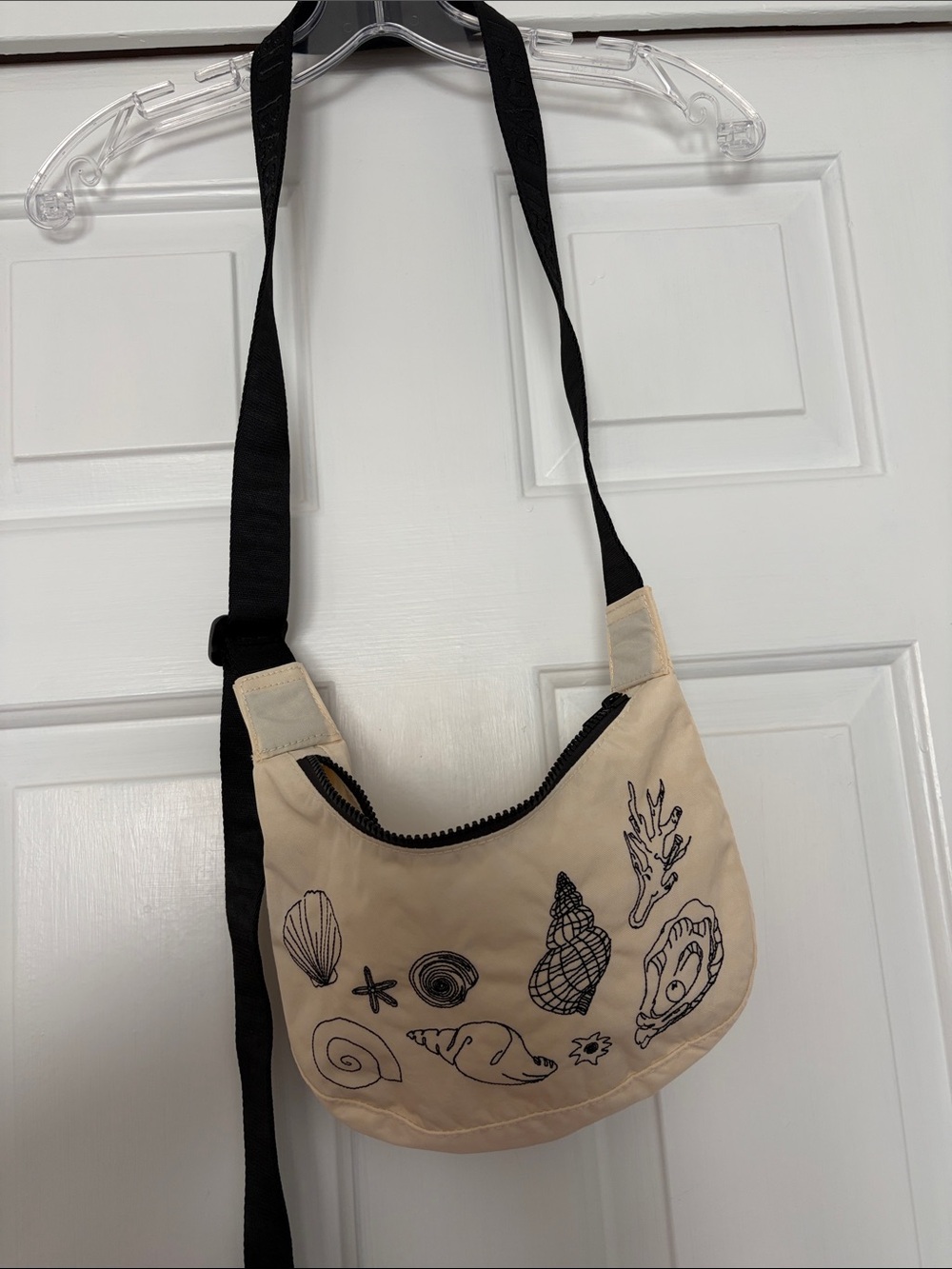 Baggu ivory small crescent bag with black shell embroidery